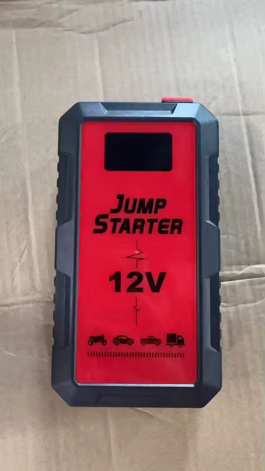 Buyer photo of the red and black 12V jump starter on its shipping box